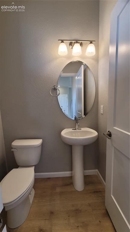 Image 13 of 26: Powder Room, conveniently located on main level!