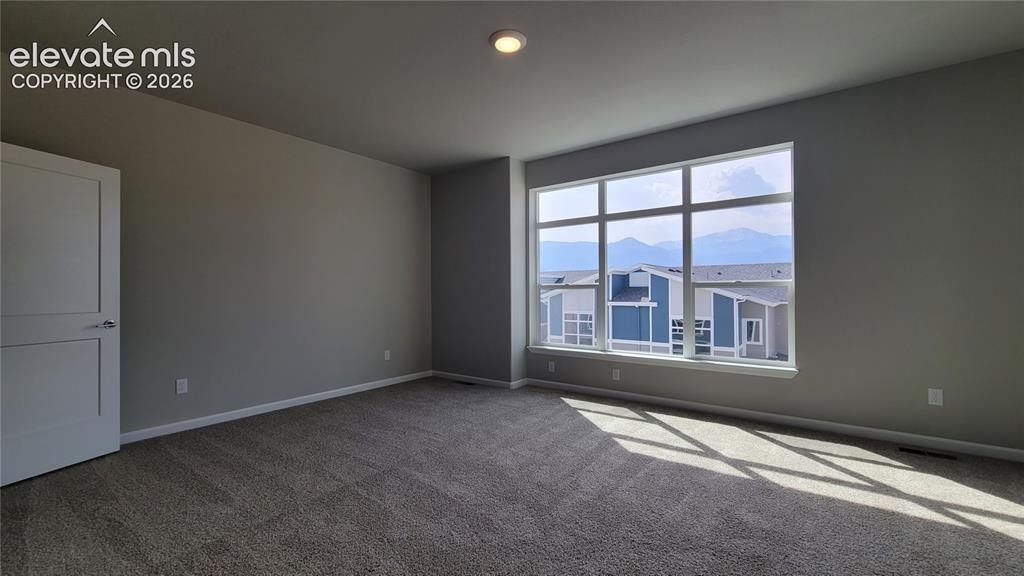 Image 14 of 26: Primary Suite is accompanied with a plush bathroom, walk-in closet, composi