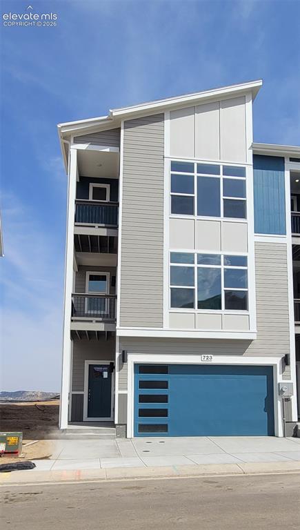 Image 2 of 26: Peak View-End Unit-3 Story-Modern Elevation-2 Car Attached Garage-Several C
