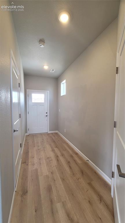 Image 3 of 26: Welcome Home! Inviting Entryway with LVP flooring, Garage access, Utility C