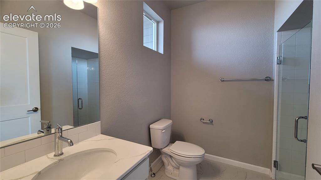Image 5 of 26: 3/4 Bathroom in the Main Level Junior Suite!