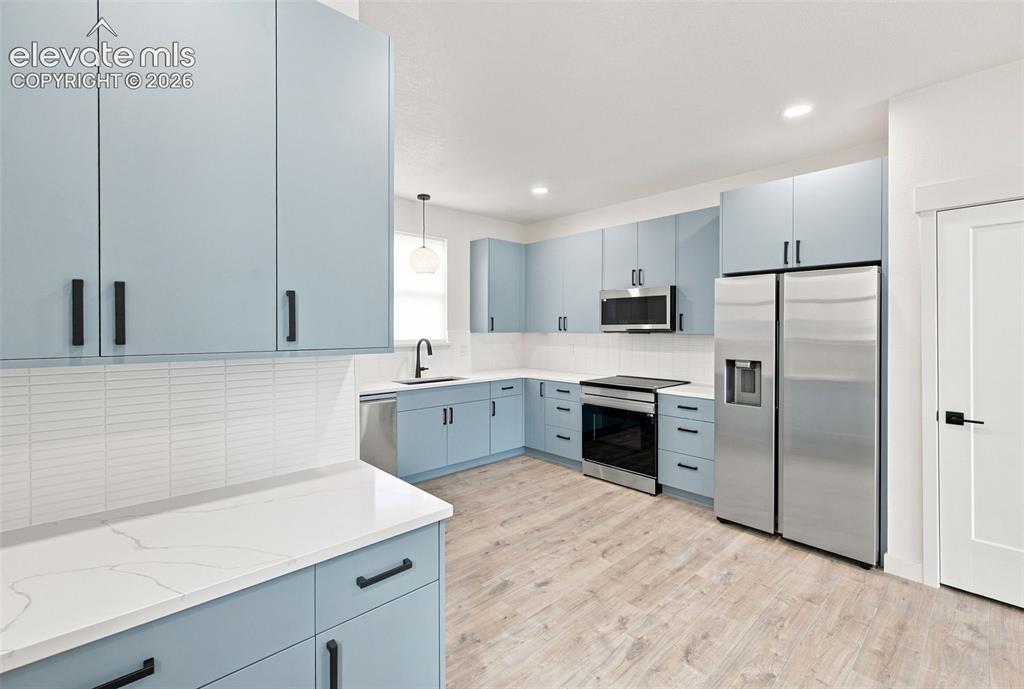 Image 2 of 36: image is from the model unit. subject property has same finishes.