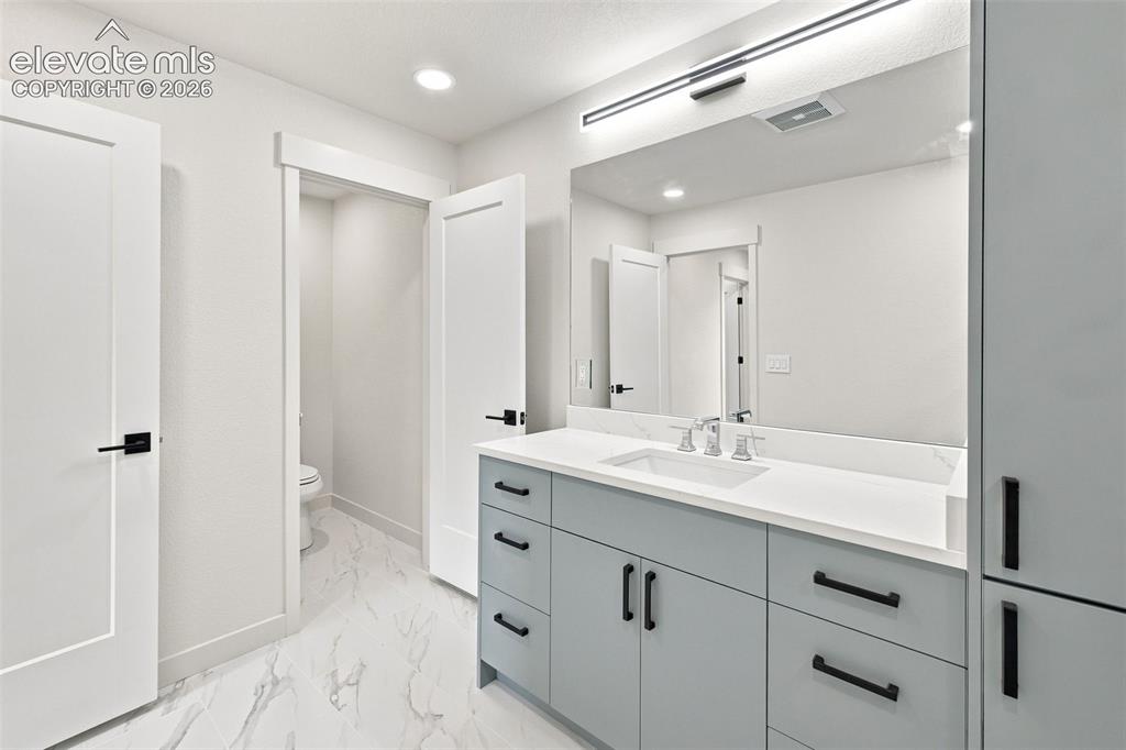 Image 27 of 36: image is from the model unit. subject property has same finishes.