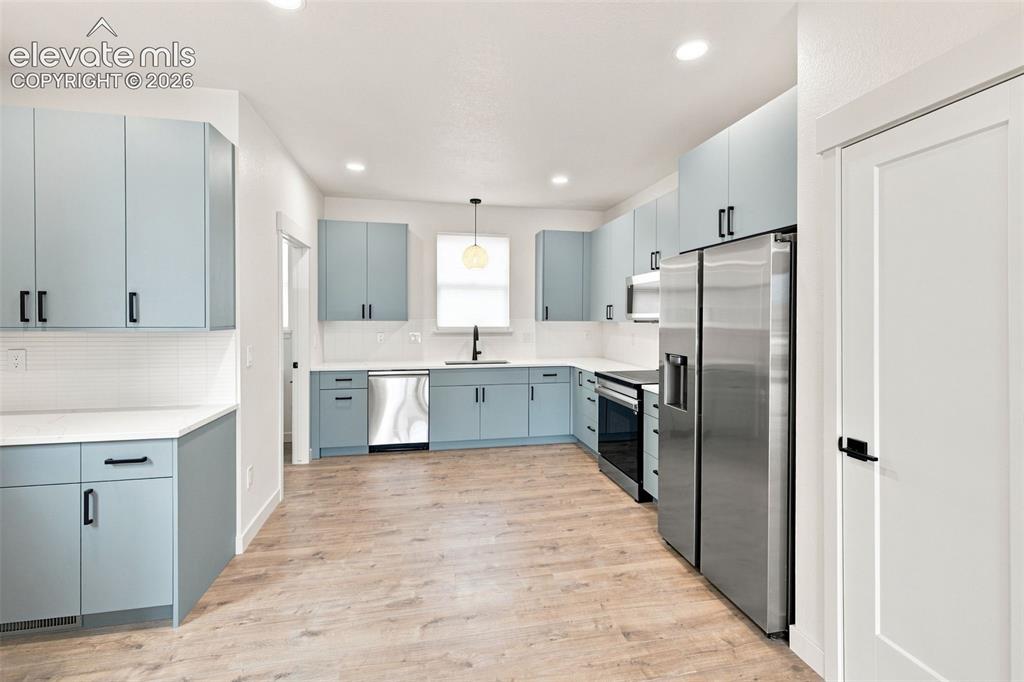 Image 3 of 36: image is from the model unit. subject property has same finishes.