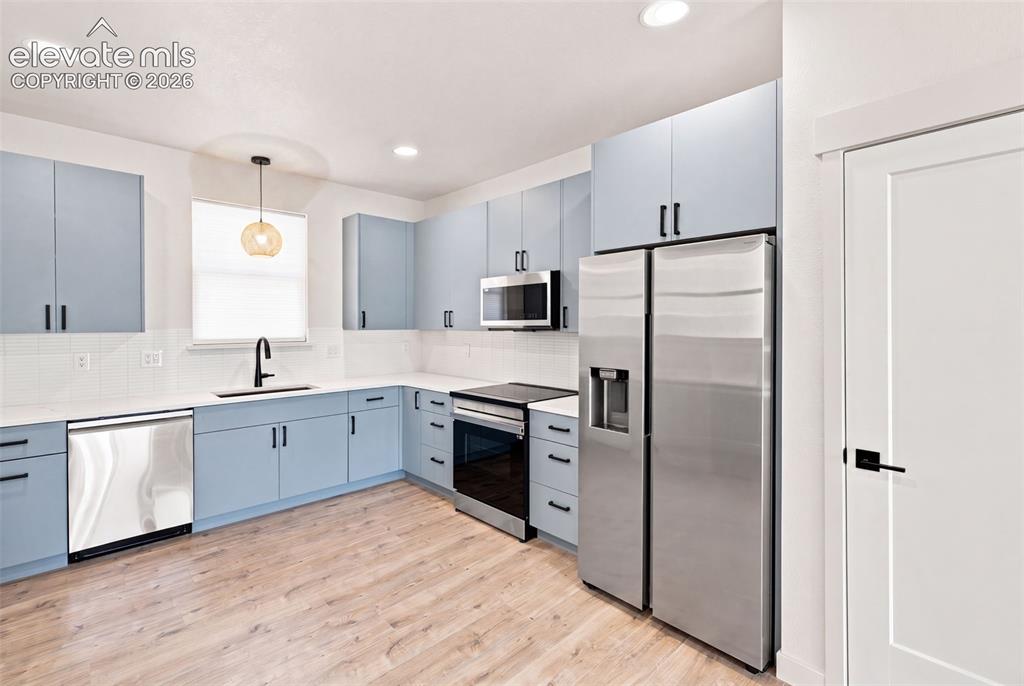 Image 4 of 21: image is from the model unit. subject property has same finishes.