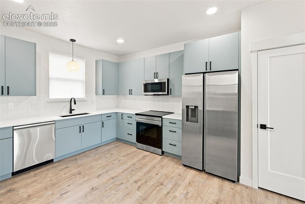 Image 4 of 36: image is from the model unit. subject property has same finishes.