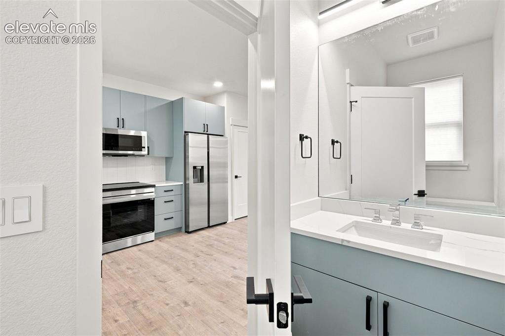 Image 6 of 36: image is from the model unit. subject property has same finishes.