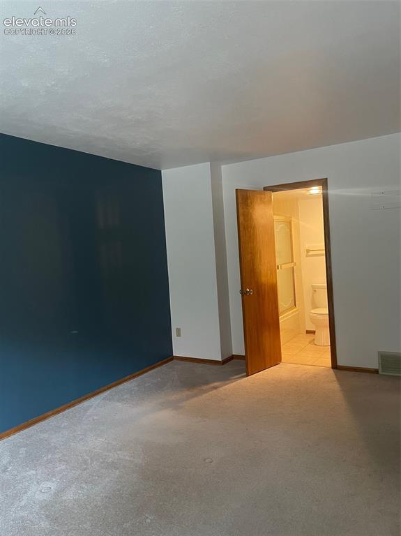 Image 13 of 35: Another view of main level bedroom to bath area.