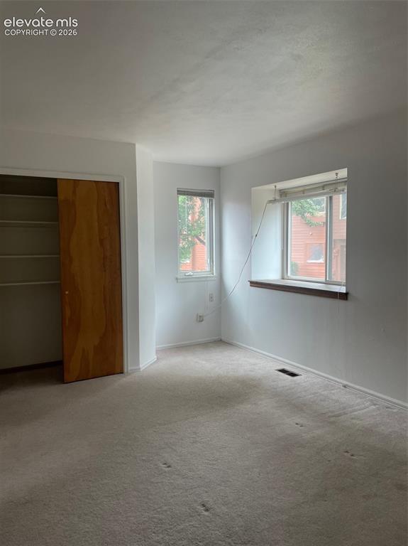 Image 26 of 35: upper level bedroom