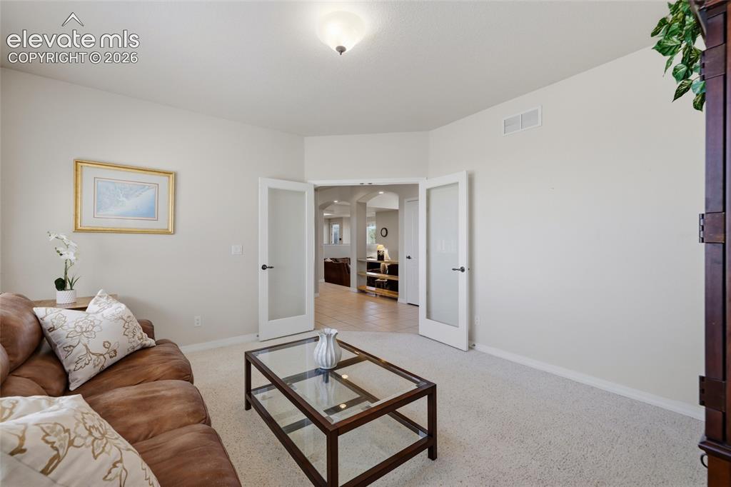 Image 25 of 50: Expansive property featuring a stucco exterior with multiple gables and a c