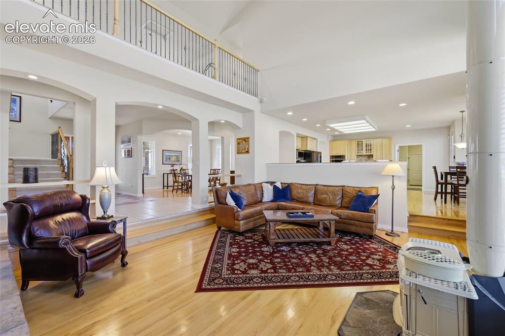 Image 26 of 50: Expansive property featuring a covered front entry and a winding driveway, 