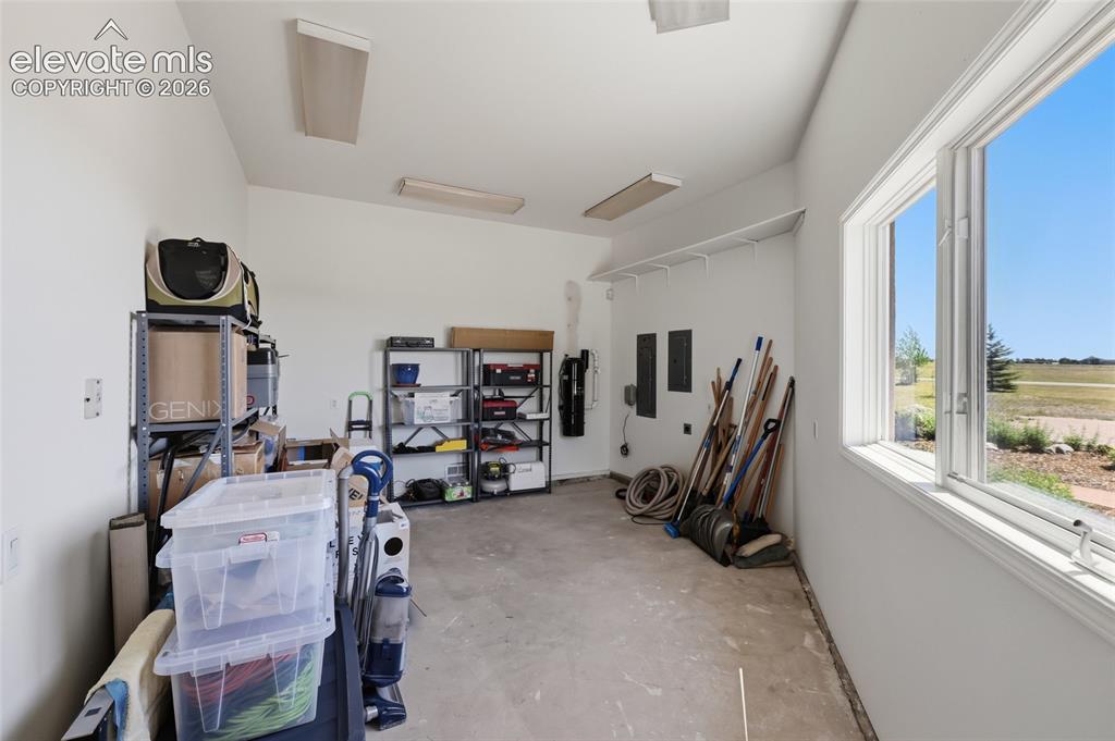 Image 45 of 50: Spacious bedroom featuring light-colored carpeting, a multi-pane bay window