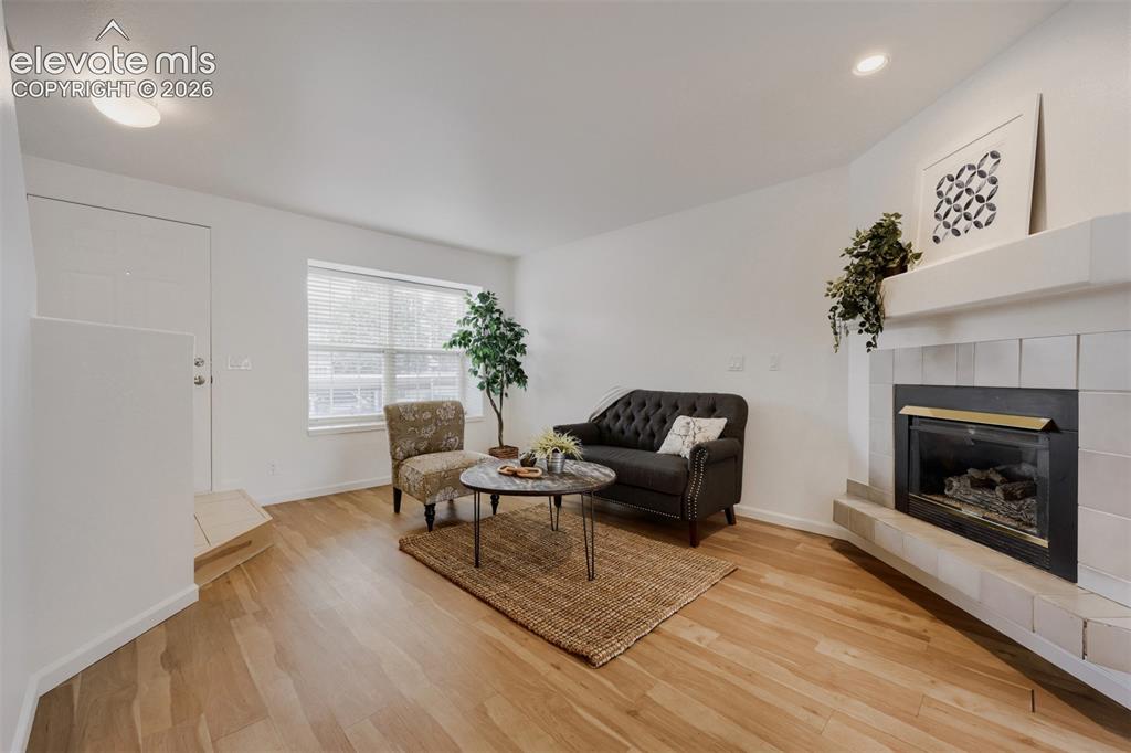 Image 2 of 16: Enter into living room with fireplace