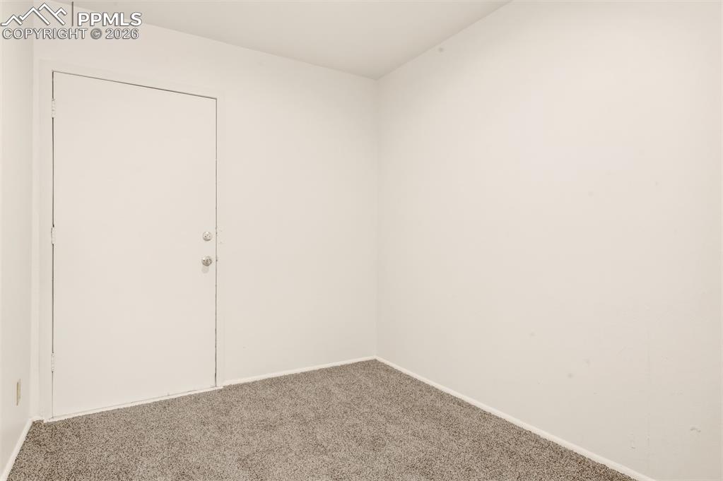 Image 10 of 18: Door leads outside to patio