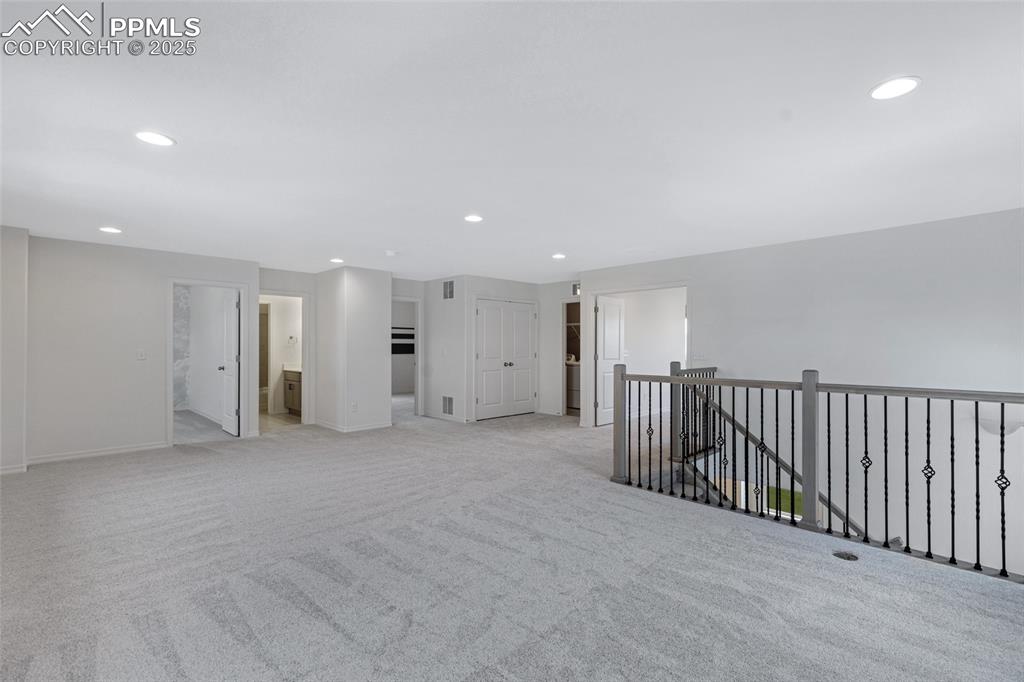 Image 22 of 50: Spare room with recessed lighting, light carpet, and baseboards
