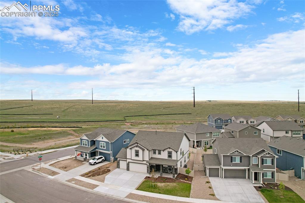 Image 41 of 50: Aerial view of sparsely populated area with nearby suburban area