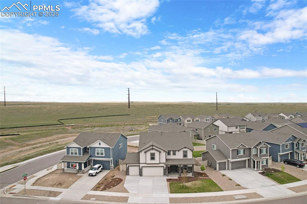 Image 43 of 50: Aerial view of sparsely populated area with nearby suburban area