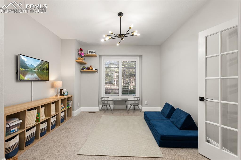 Image 17 of 38: Office On Main Level Used As Kids