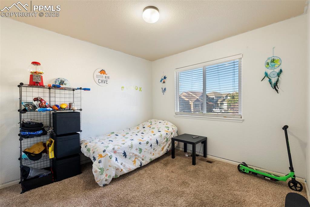 Image 30 of 46: Bedroom featuring carpet flooring