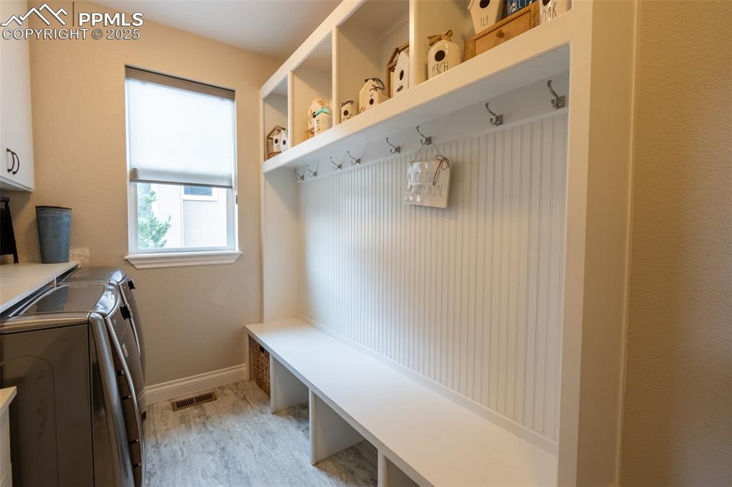 Image 17 of 50: Laundry/mud room off garage entry - main floor