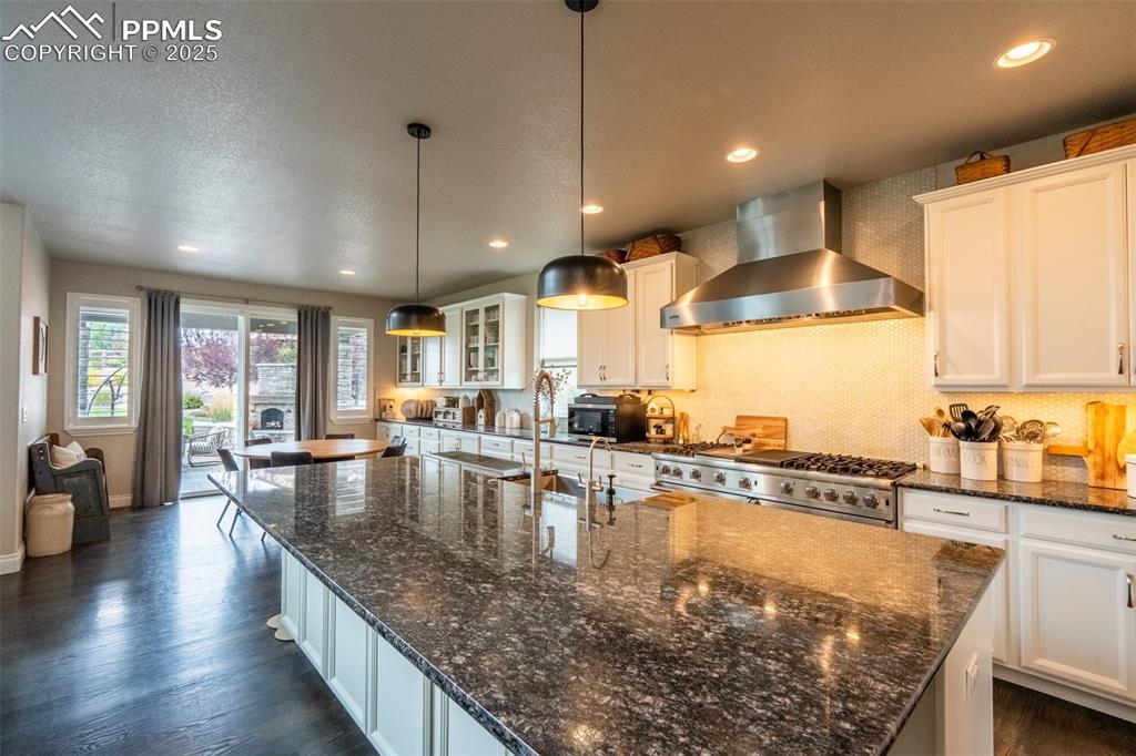 Image 6 of 50: Kitchen and dining area with walk out - main floor