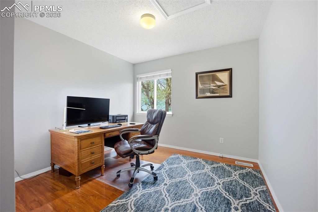 Image 22 of 46: Home office with light wood-type flooring