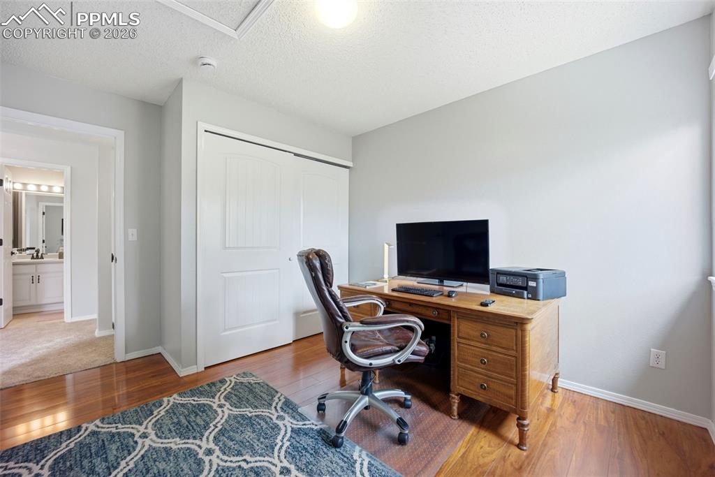 Image 23 of 46: Home office with light wood-type flooring