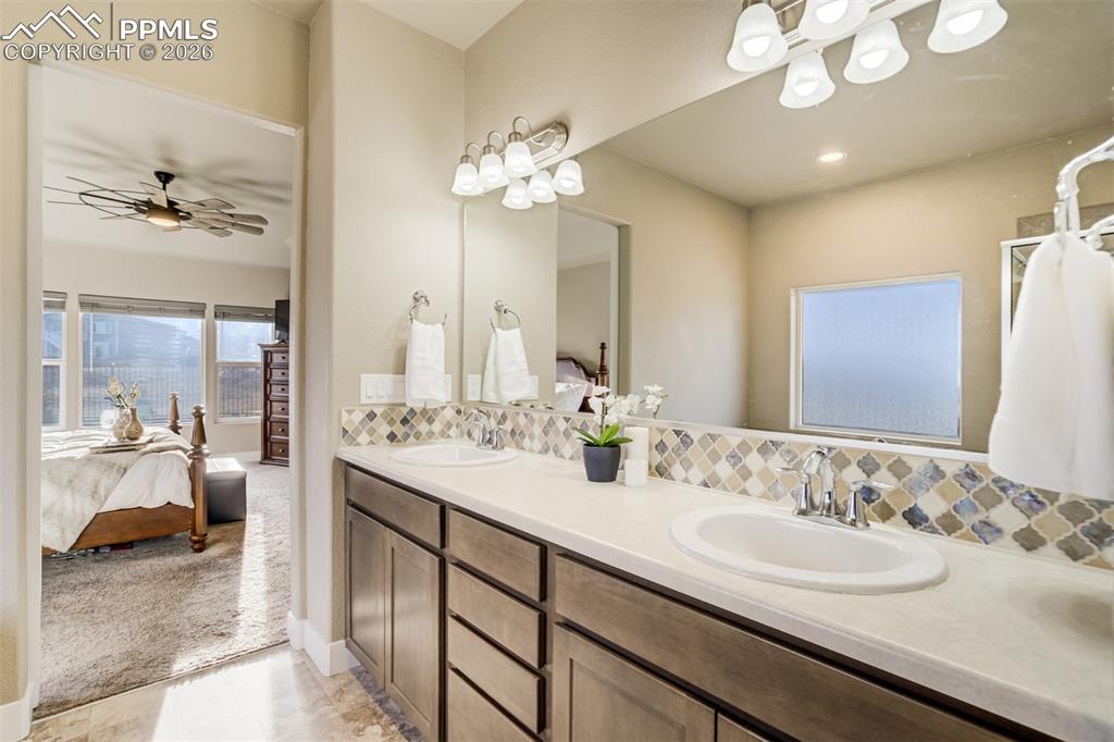 Image 21 of 49: Double vanities—because love is great, but counter space is better.