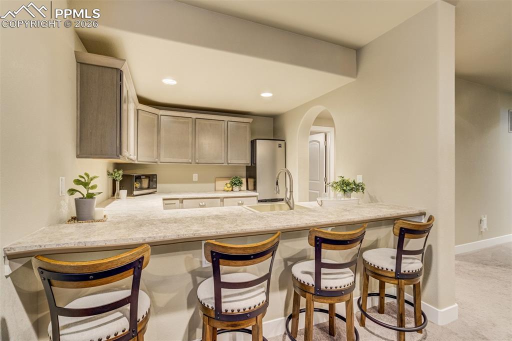 Image 30 of 49: Pull a chair up and stay awhile. 