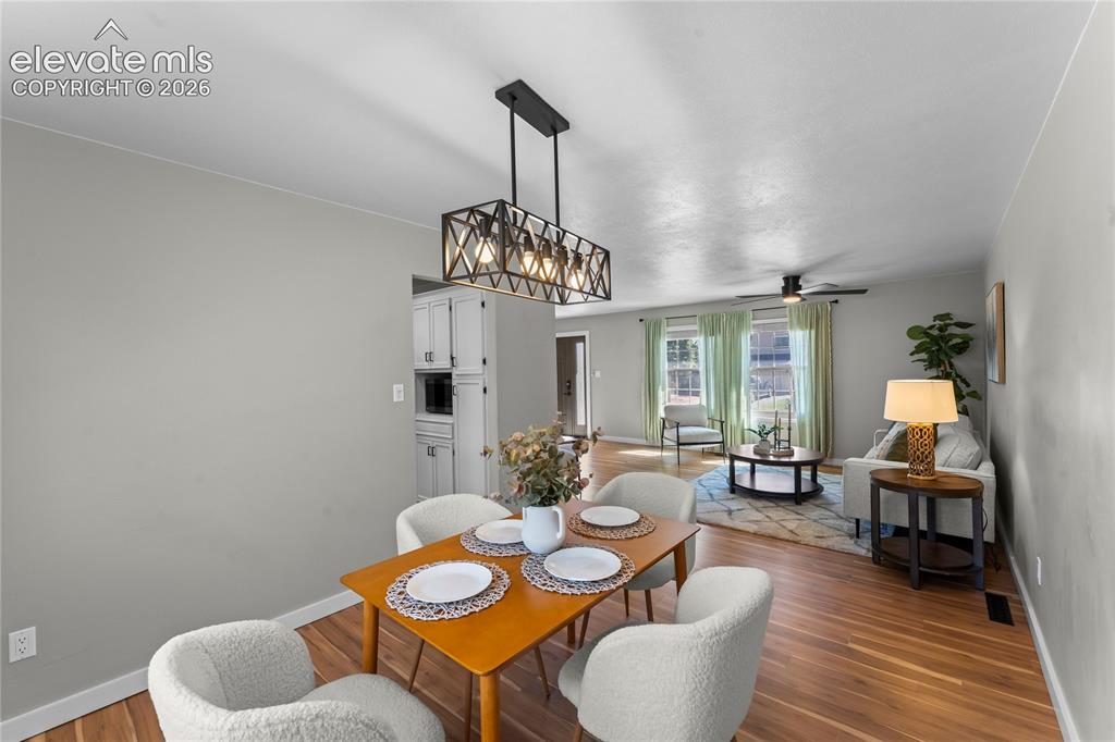 Image 10 of 50: Elegant open-concept dining area that serves as the heart of the home. Anch