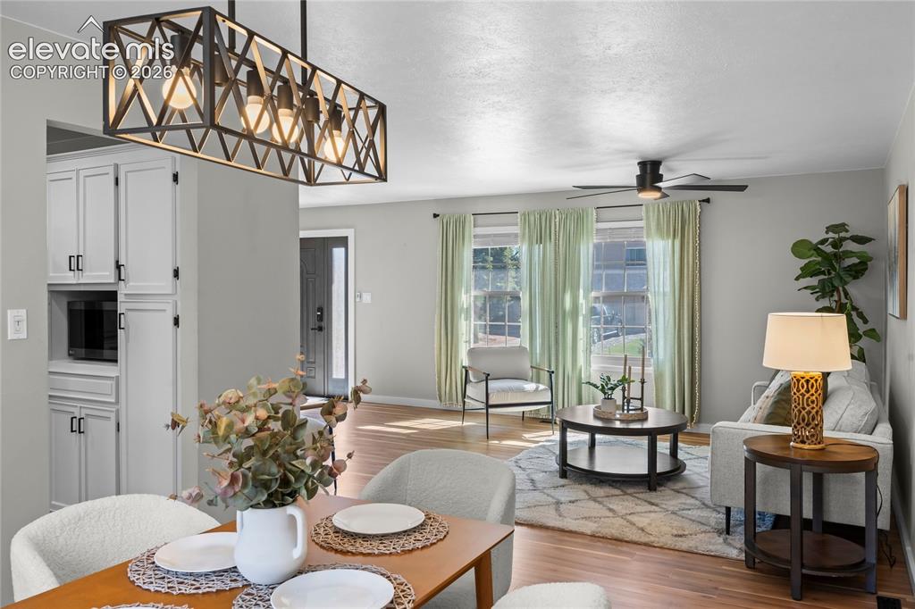 Image 12 of 50: Elegant open-concept dining area that serves as the heart of the home. Anch
