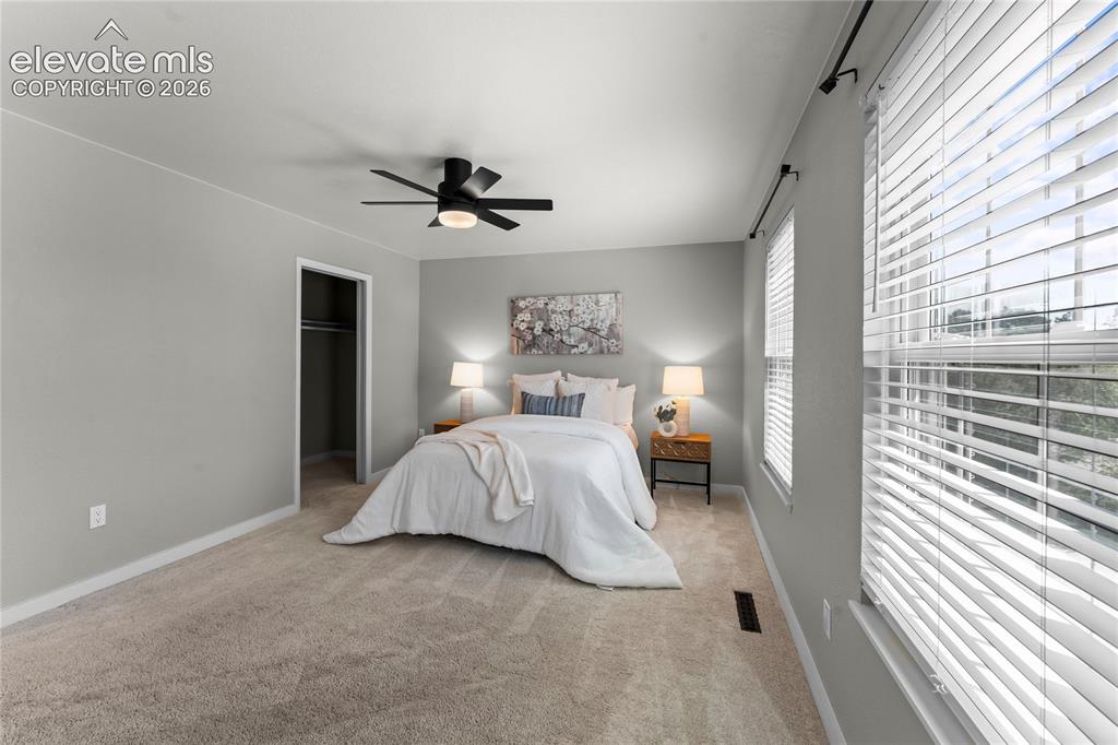 Image 19 of 50: Spacious and quiet, this primary suite offers a neutral palette ready for y
