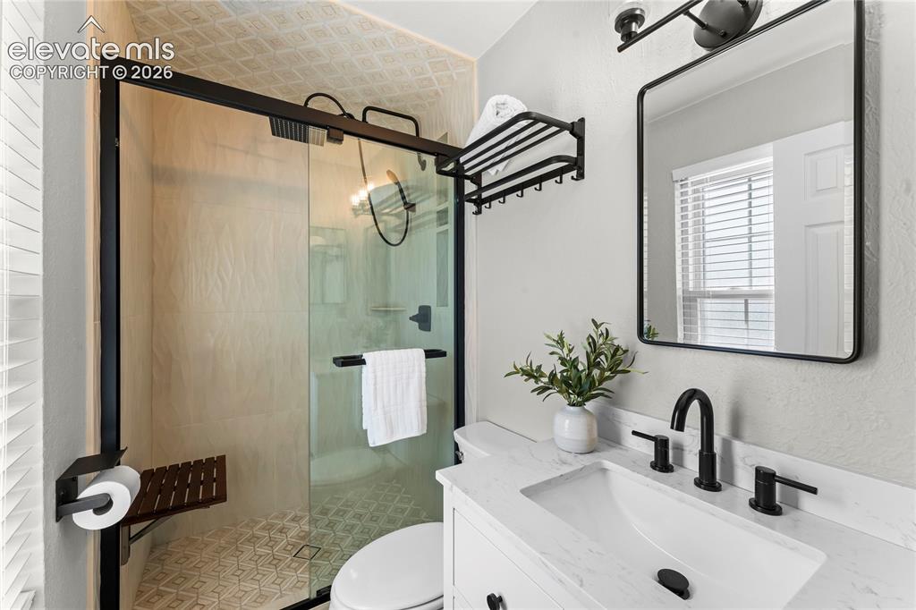 Image 21 of 50: Uncompromising quality defines this primary bath, boasting custom inlaid ma