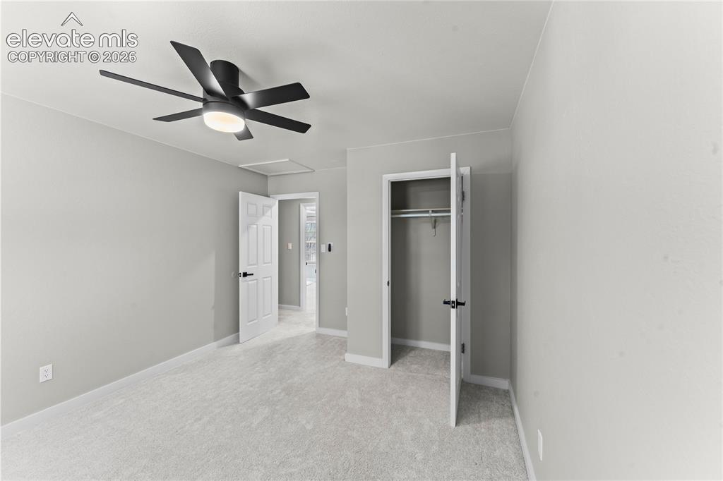 Image 22 of 50: Bright and airy upstairs bedroom featuring a neutral color palette, plush c
