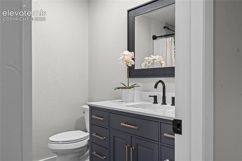 Image 24 of 50: Modern luxury meets smart home technology! This bathroom boasts custom arti