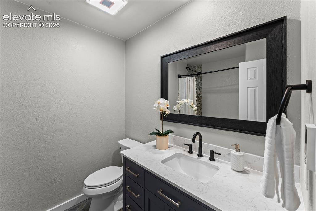 Image 25 of 50: Modern luxury meets smart home technology! This bathroom boasts custom arti