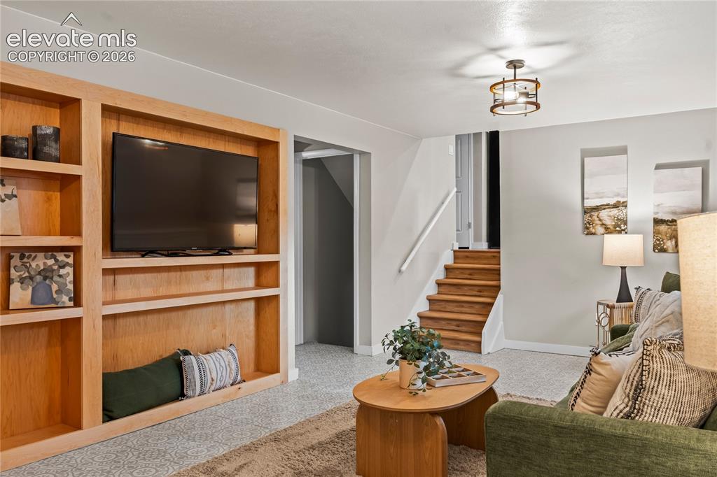 Image 26 of 50: The ultimate "Wow" factor! This lower-level den features a massive, hand-ma
