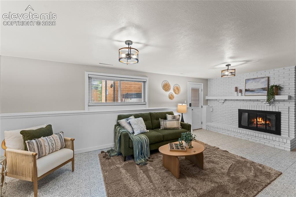 Image 28 of 50: This bright transition space features soft, neutral tones and patterned car