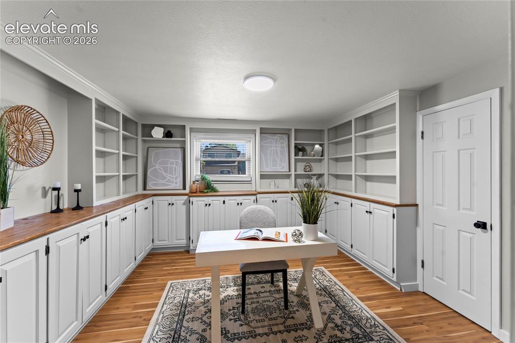 Image 31 of 50: Tucked behind the secret Murphy door, this private office is an executive’s