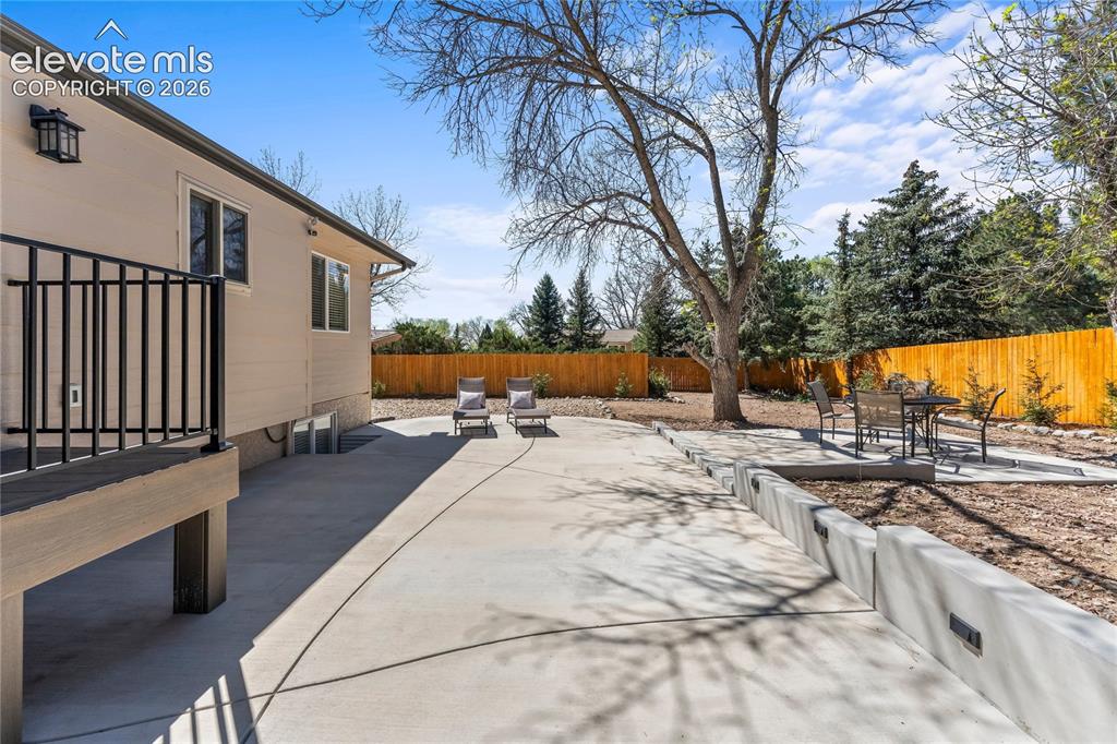 Image 39 of 50: The ultimate outdoor oasis! This massive 1,250 sq. ft. lighted patio is des