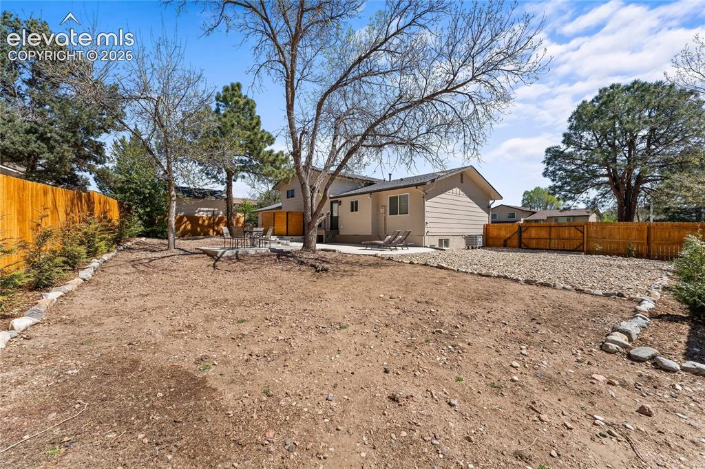 Image 46 of 50: our own private sanctuary! This massive backyard is fully enclosed by a pre