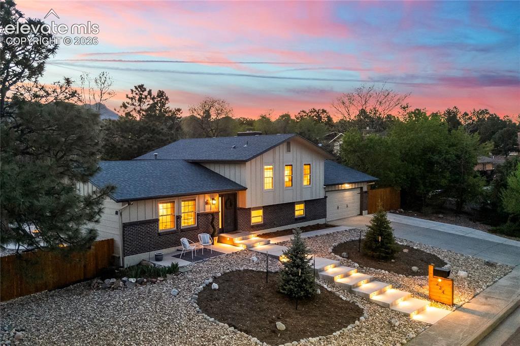 Image 50 of 50: Welcome home. This stunning twilight view captures the essence of Golden Hi