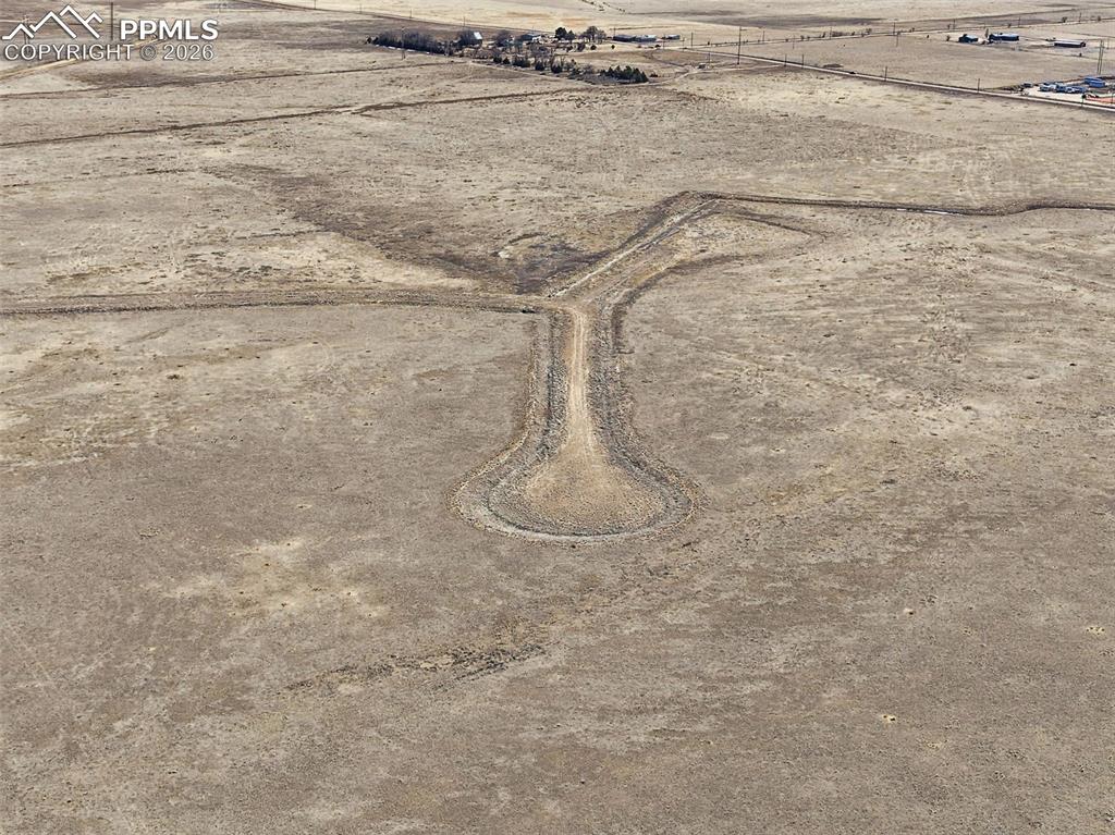 Image 5 of 10: Aerial View – Drive Access & Layout – Elevated perspective showing the esta