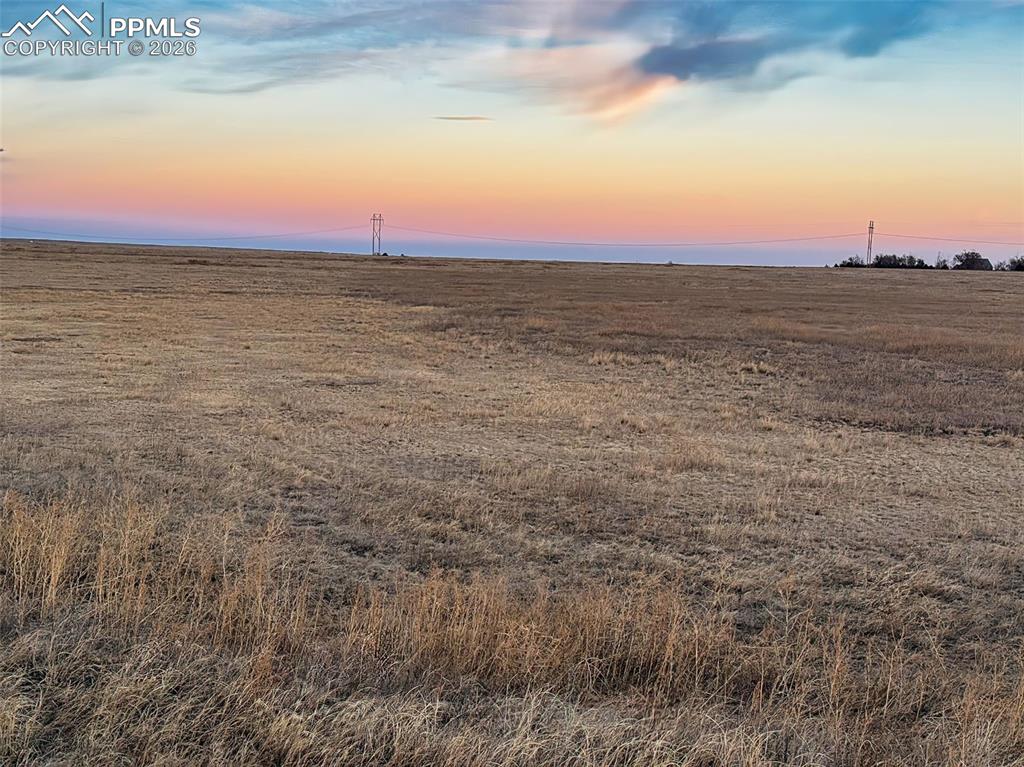 Image 9 of 10: Lot View – Pastel Evening Sky – Subtle sunset tones over the prairie offer 
