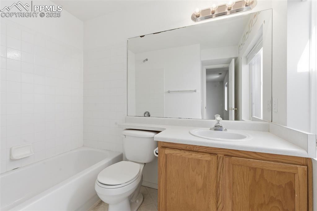 Image 29 of 45: Basement - full bath serving bedroom #4