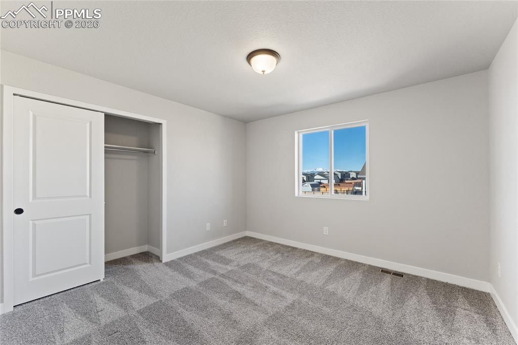 Image 25 of 48: Upper Level Bedroom