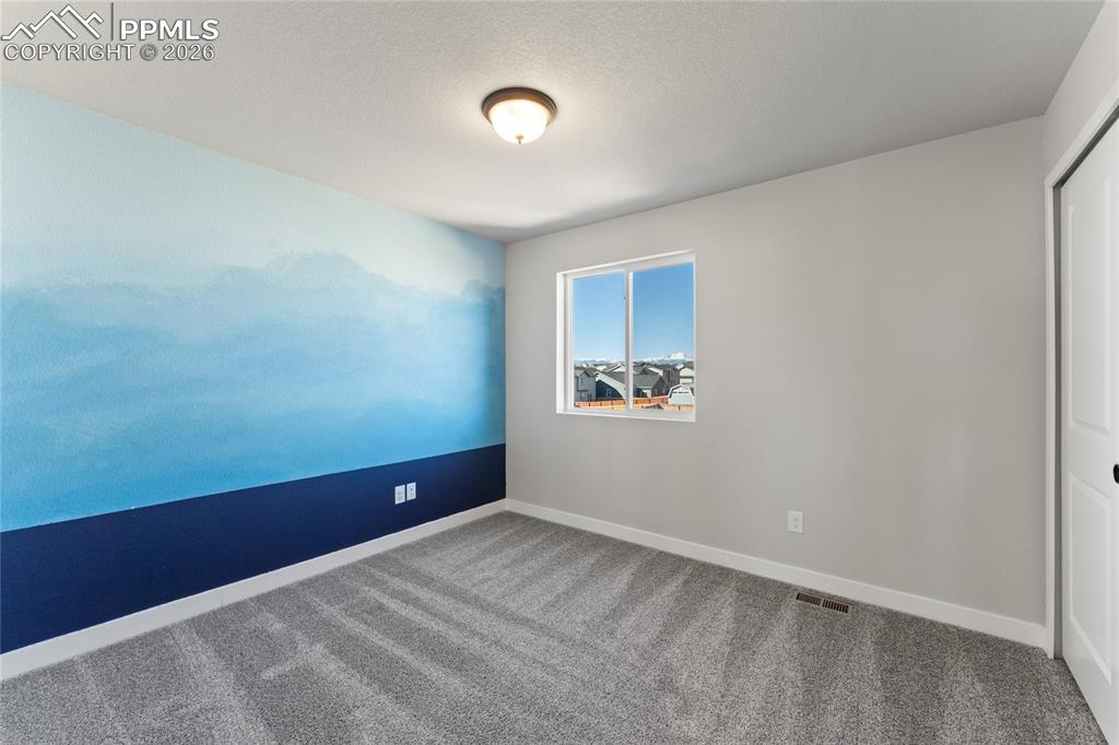 Image 30 of 48: Upper Level Bedroom