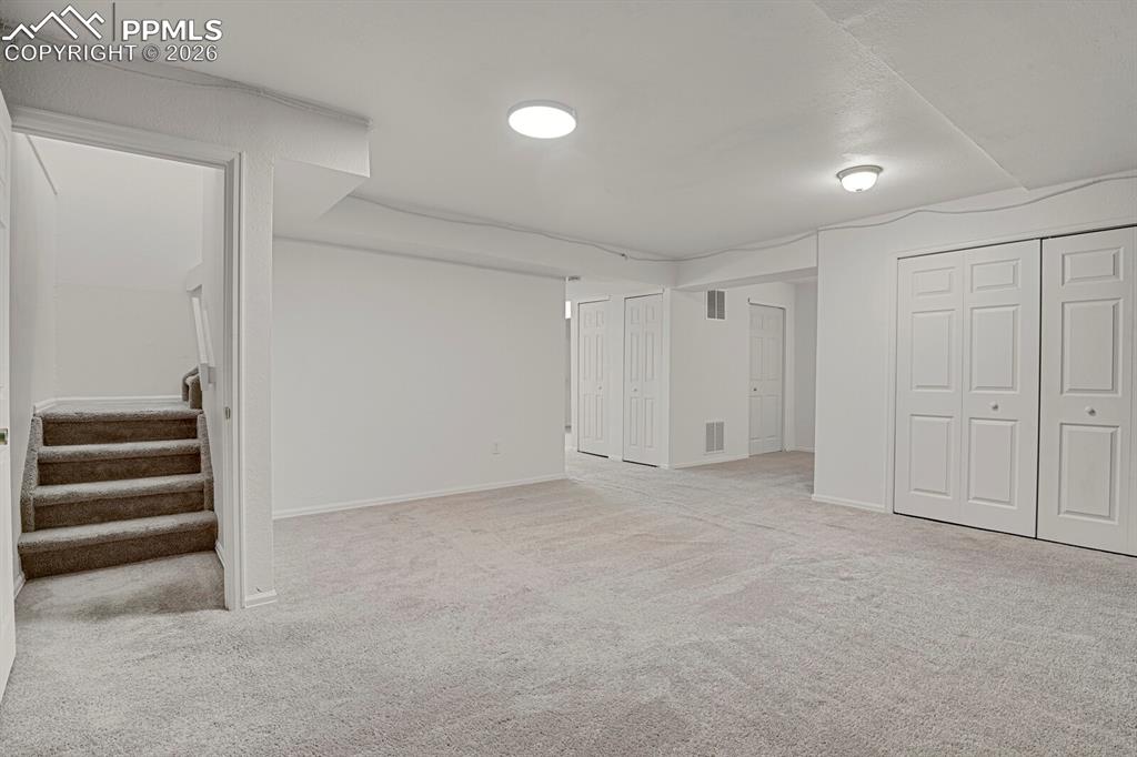 Image 12 of 19: FinishedFamily Room area with carpet