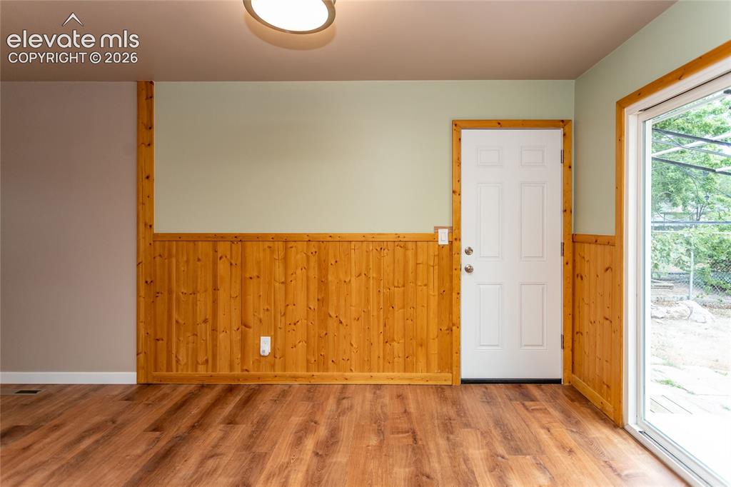 Image 15 of 46: Dining area with door to garage