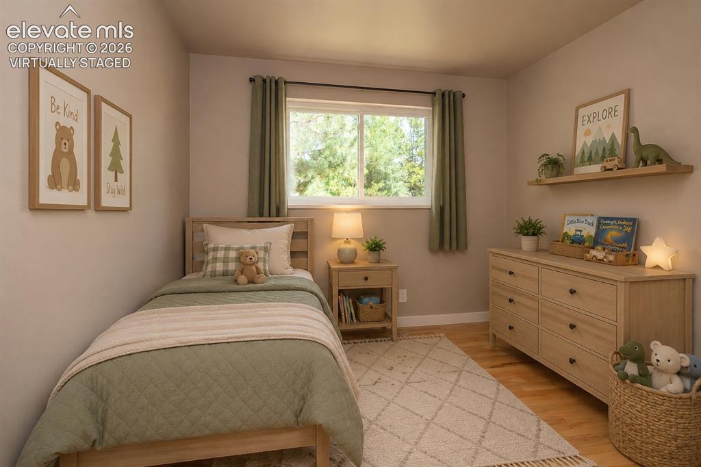 Image 22 of 46: Virtually staged upper level 2nd bedroom